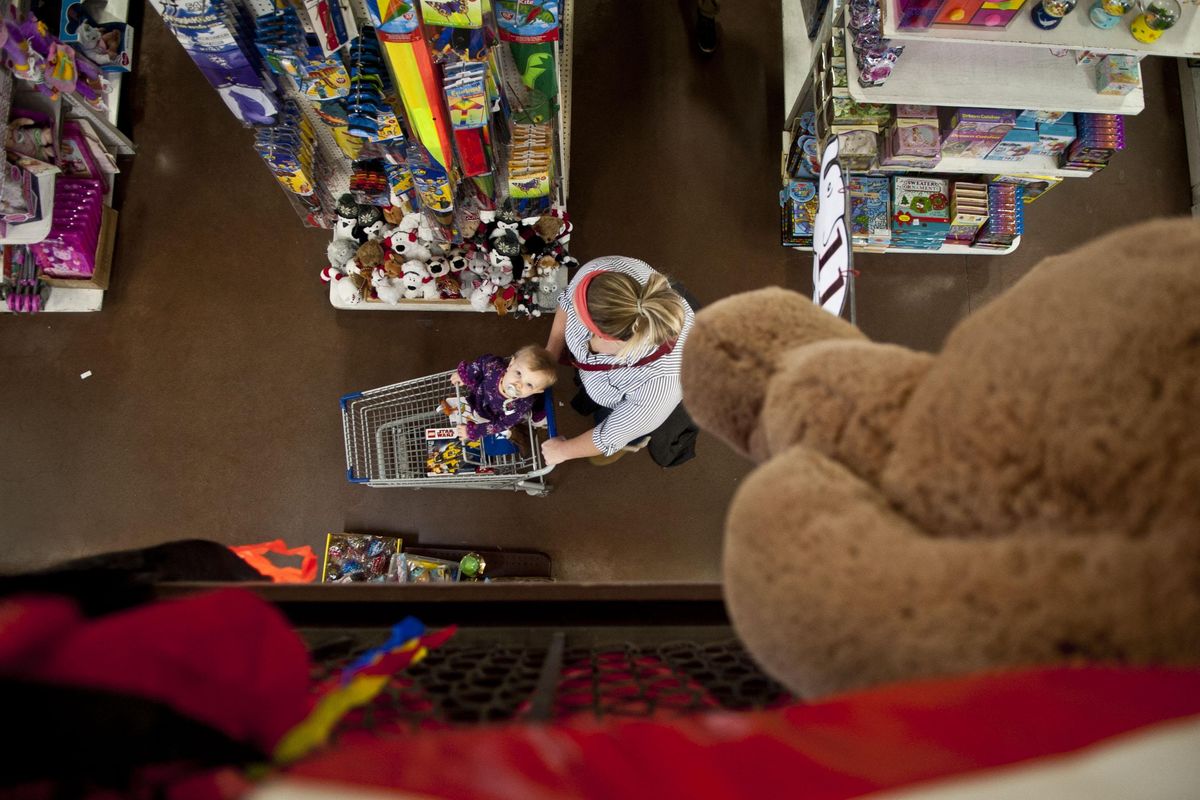 One-year-old Caroline Blumenkrantz of Spokane Valley shops with her mother, Sarai, at White Elephant in Spokane Valley on Wednesday, Nov. 27, 2019. (Kathy Plonka / The Spokesman-Review)