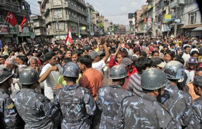 
Demonstrators gather in Katmandu on Sunday to protest King Gyanendra and the Nepalese government. Violence has rocked the nation, and a general strike  is continuing. 
 (Associated Press / The Spokesman-Review)