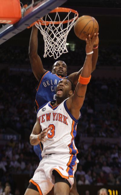 New York Knicks’ Tracy McGrady drives past Oklahoma City’s Serge Ibaka.  (Associated Press)