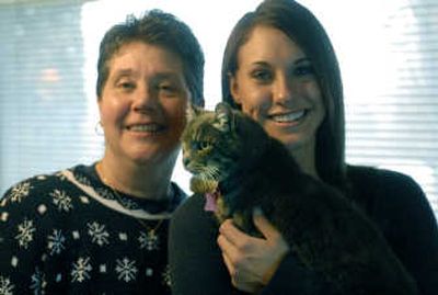 
Sarah has been returned to her owners, Judy and Kristin Polley, after the frightened 14-year-old cat was found wandering in the same neighborhood she disappeared from seven years ago. 
 (J. BART RAYNIAK / The Spokesman-Review)