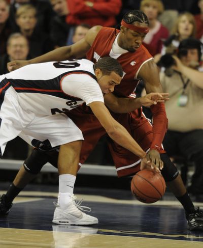 Gonzaga's Elias Harris and WSU's DeAngelo Casto chase a loose ball in the second half in McCarthey Athletic Center Wed. Dec. 2, 2009. (Colin Mulvany / The Spokesman-Review)