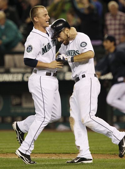 The Mariners are pleased with Kyle Seager, left, and perplexed by Dustin Ackley. (Associated Press)