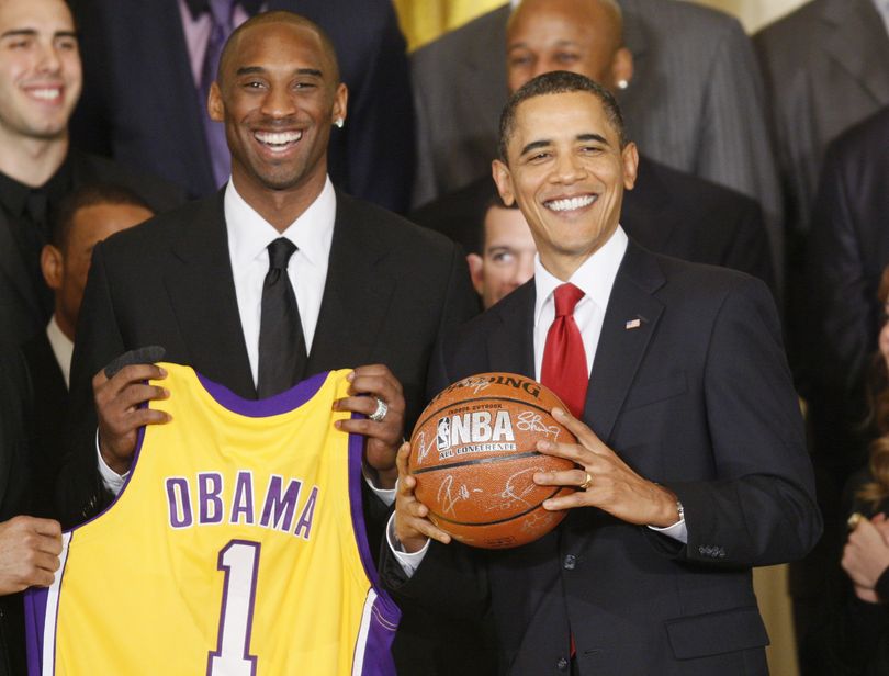 President Barack Obama stands with Los Angeles Lakers guard Kobe Bryant, in the East Room of the White House in Washington, Monday, Jan. 25, 2010, during a ceremony honoring the 2009 NBA basketball champions Los Angeles Lakers. (Charles Dharapak / Associated Press)