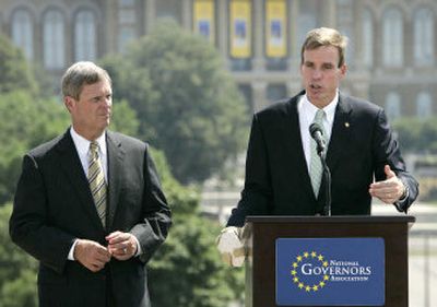 
Virginia Gov. Mark Warner, chairman of the National Governors Association, talks during the association's annual meeting as Iowa Gov. Tom Vilsack listens Saturday.
 (Associated Press / The Spokesman-Review)