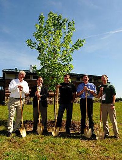 (Left to right) Rex Boner of The Conservation Fund, Mike Lynch, Managing Director of Green Innovation for NASCAR, Ryan Newman, Sprint Cup Series Driver, Roger Curtis, President of Michigan International Speedway and Kevin Sayers, Michigan State Coordinator of Urban and Community Forestry Program Kevin Sayers plant a tree for NASCAR's Tree-Planting Program To Capture Carbon Emissions prior to practice for the NASCAR Sprint Cup Series LifeLock 400 at Michigan International Speedway on Friday in Brooklyn, Mich. (Photo Credit: Rusty Jarrett/Getty Images for NASCAR) (Rusty Jarrett / The Spokesman-Review)
