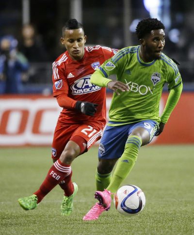 Seattle Sounders’ Oniel Fisher, right, dribbles around FC Dallas’ Michael Barrios, left, in the first half of an MLS soccer western conference semifinal playoff match, Sunday, Nov. 1, 2015, in Seattle. (Ted S. Warren / Associated Press)