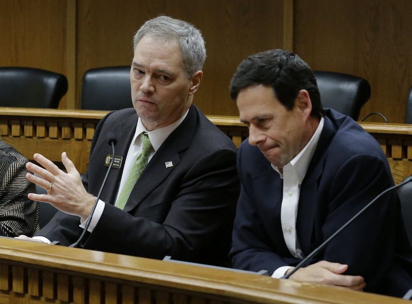 OLYMPIA -- Rep. Ross Hunter, left, and Sen. Andy Hill discuss the state's budget situation during the AP Legislative Preview Thursday. (Ted S. Warren / AP Photo)
