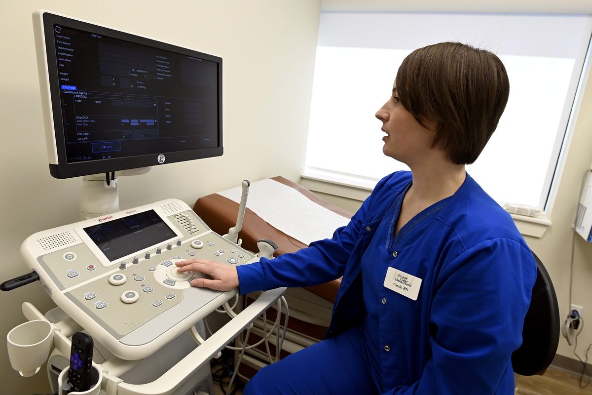 Nurse Cassie Owen demonstrates an ultrasound machine at the Portico Crisis Pregnancy Center Jan. 26, 2022, in Murfreesboro, Tenn. States that have passed ever-restrictive abortion laws also have been funneling millions of taxpayer dollars into privately operated clinics that steer women away from abortions but provide little if any health care services.  (Mark Zaleski)