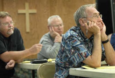 
Pastors, left to right, Steve Williams  of Spokane Valley's New Life Church, Carl Palmer  of Spokane's Church of God Seventh Day and David Cox  of Crestline Nazarene Church in Hillyard listen Thursday to Spokane Catholic Diocese Bishop William Skylstad on dealing with and preventing sexual abuse. 
 (Holly Pickett / The Spokesman-Review)