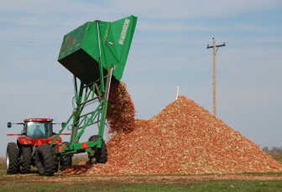 
A dump wagon adds freshly gathered corn cobs to a pile on a farm near Hurley, S.D. The boom has burst on ethanol, and many potential investors are now looking elsewhere.Associated Press
 (FILE Associated Press / The Spokesman-Review)