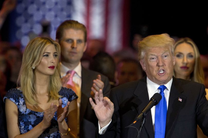 Republican presidential candidate Donald Trump is joined by his daughter Ivanka, left, and son Eric, background left, as he speaks during a primary night news conference, Tuesday, May 3, 2016, in New York. (AP Photo/Mary Altaffer)