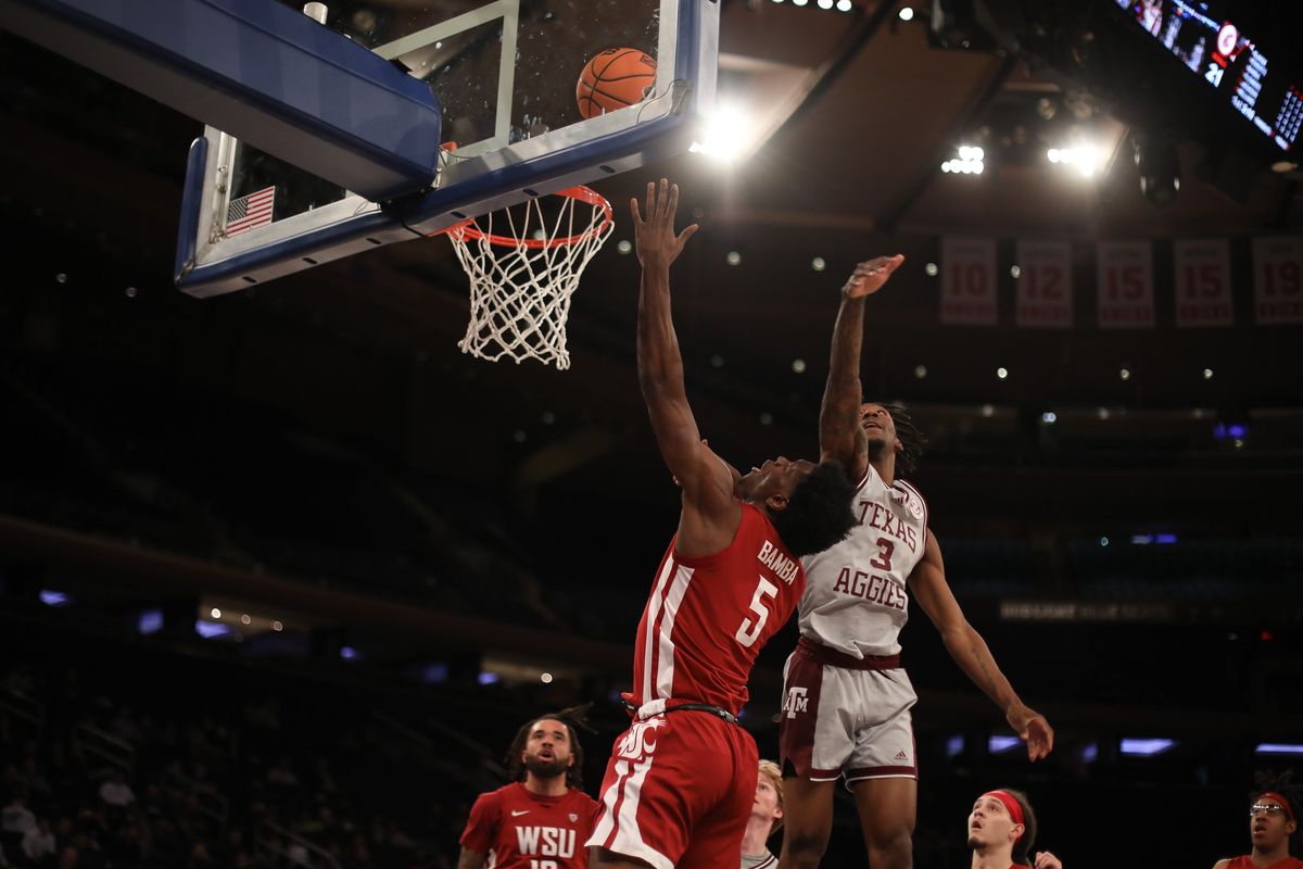 Washington State guard TJ Bamba attempts a layup against Texas A&M’s Quenton Jackson during an NIT semifinal Tuesday at Madison Square Garden.  (Ashley Davis/WSU Athletics)