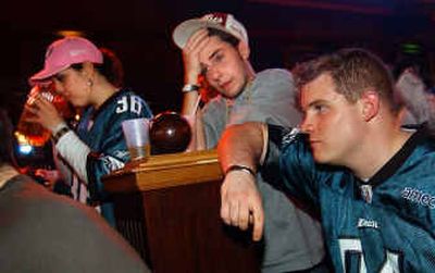 
Philadelphia fans were left to drown their sorrows after the Eagles fell to the New England Patriots in Super Bowl XXXIX. 
 (Associated Press / The Spokesman-Review)