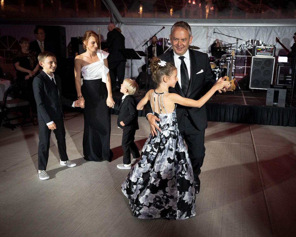 Mayor David Condon and his wife Kristin share the first dance of the Our Town Gala with their children left to right, Creighton, 10, Beck, 5, and Hattie,.9, Friday night in the U.S. Pavilion in Riverfront Park. The annual gala, hosted by Condons, has raised a million dollars for local charities over the eight years of his administration. (Colin Mulvany / The Spokesman-Review)