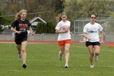 West Valley distance runner Krystal Hughes, left, works out with her teamates Tuesday. She’s the league leader in the 3,200.  (J. BART RAYNIAK / The Spokesman-Review)