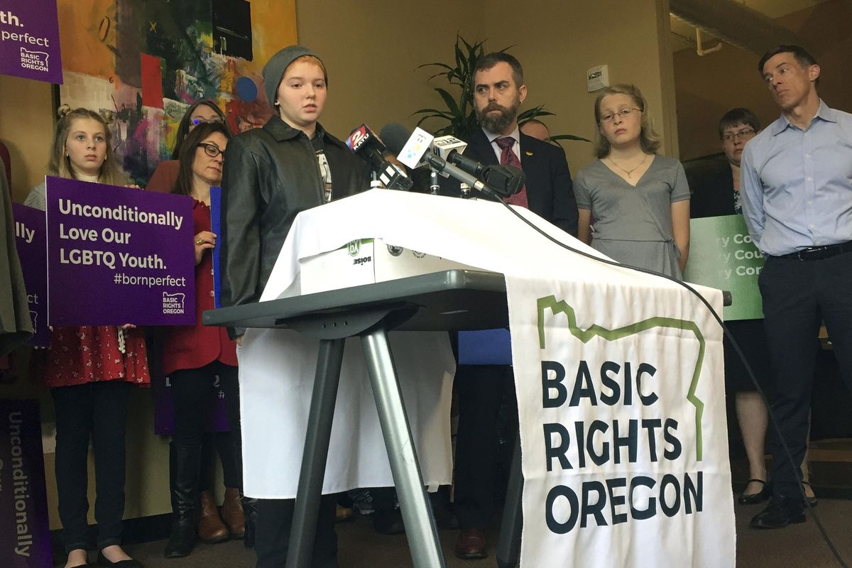 Elliot Yoder, 16, a transgender student at Dallas High School in Dallas, Ore., speaks at a news conference held by ACLU Oregon and Basic Rights in Portland, Ore., Thursday, Nov. 16, 2017, to protest a federal lawsuit filed against the Dallas School District over its policy on the treatment of transgender students. The district began allowing Yoder to use the boys