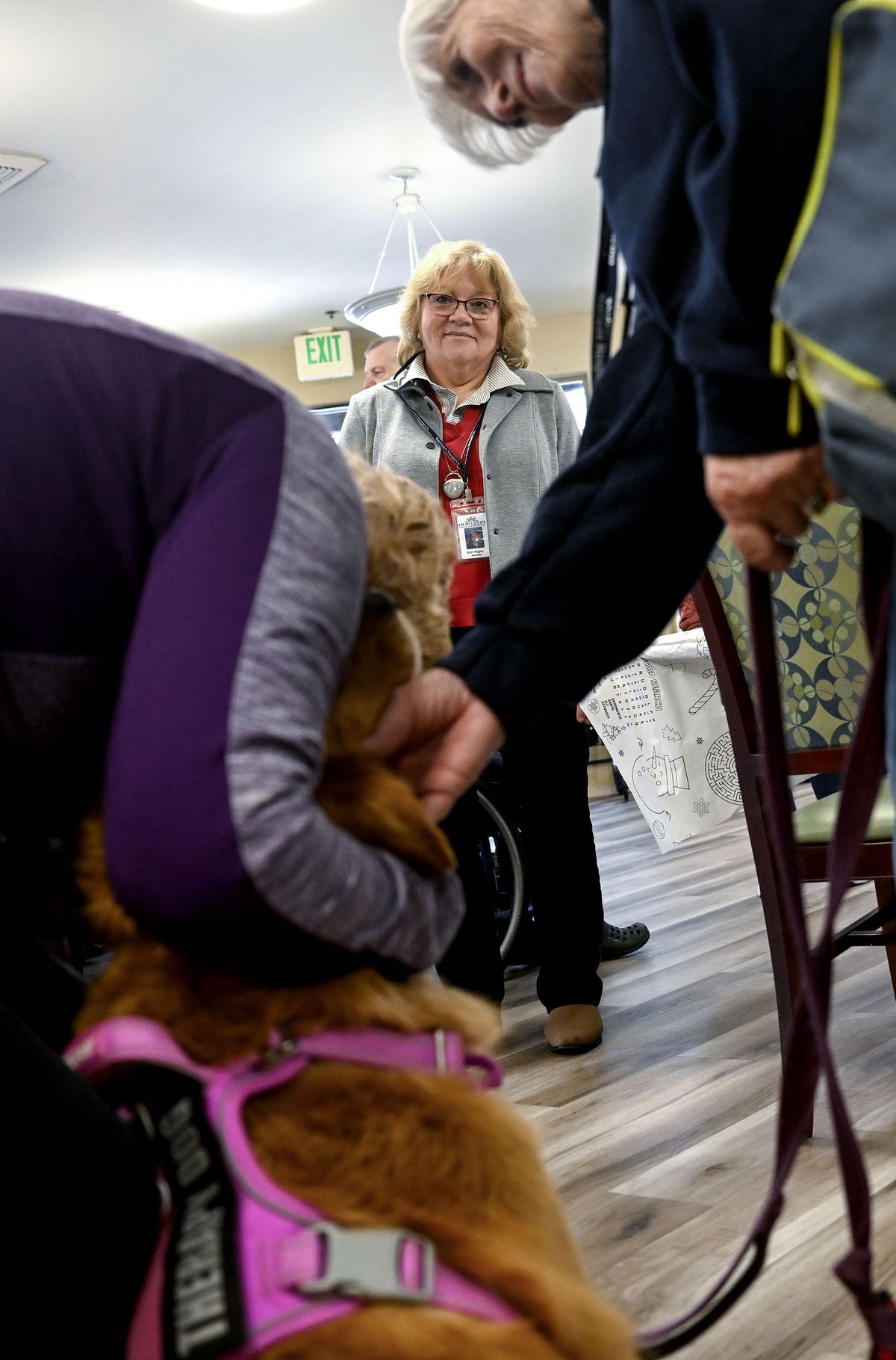 Ruth Wagley watches a therapy dog at Fairwood Retirement Village and Assisted Living on Tuesday, December 2, 2025. Spokane Volunteers are the heart of Horizon Hospice and volunteer coordinator Ruth Wagley trains and schedules a host of volunteers.  (Kathy Plonka/The Spokesman-Revie)