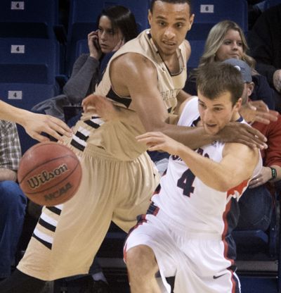 Gonzaga’s Kevin Pangos battles Oakland’s Tommy McCune for a rebound. (Dan Pelle)