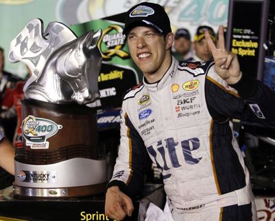 Brad Keselowski poses with the trophy after winning the Sprint Cup series auto race Saturday at Kentucky Speedway in Sparta, Kentucky. (Associated Press)
