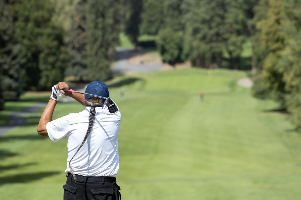 Wilton GoodStriker tees off on the first hole at Indian Canyon Golf Course Wednesday, August 29, 2018. GoodStriker was in Spokane with other members of a Blackfeet tribe from Canada for a retreat. Indian Canyon will close its front nine in mid-September to begin a major irrigation project designed to save money and conserve water at the golf course. The money to refit all the citys golf courses will come in the form of a loan from the city, which will be paid back by golfers with a small bump in the greens fees. (Jesse Tinsley / The Spokesman-Review)