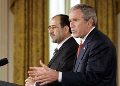 
President Bush and Iraqi Prime Minister Nouri al-Maliki, left, hold a joint press conference Tuesday in the East Room during al-Maliki's first visit to the White House. 
 (Associated Press / The Spokesman-Review)