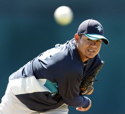 Mariners starting pitcher Felix Hernandez made his spring debut on Sunday against Colorado. He was on a pitch count and went 2  2/3  innings.  (Associated Press)