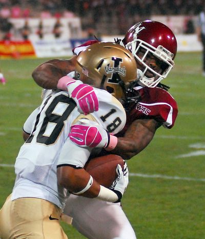 Idaho receiver Mike Scott (18), in a battle with New Mexico State's Jonte Green earlier this season, is the only healthy receiver left from the original promising group of four that started in fall camp. (Associated Press)