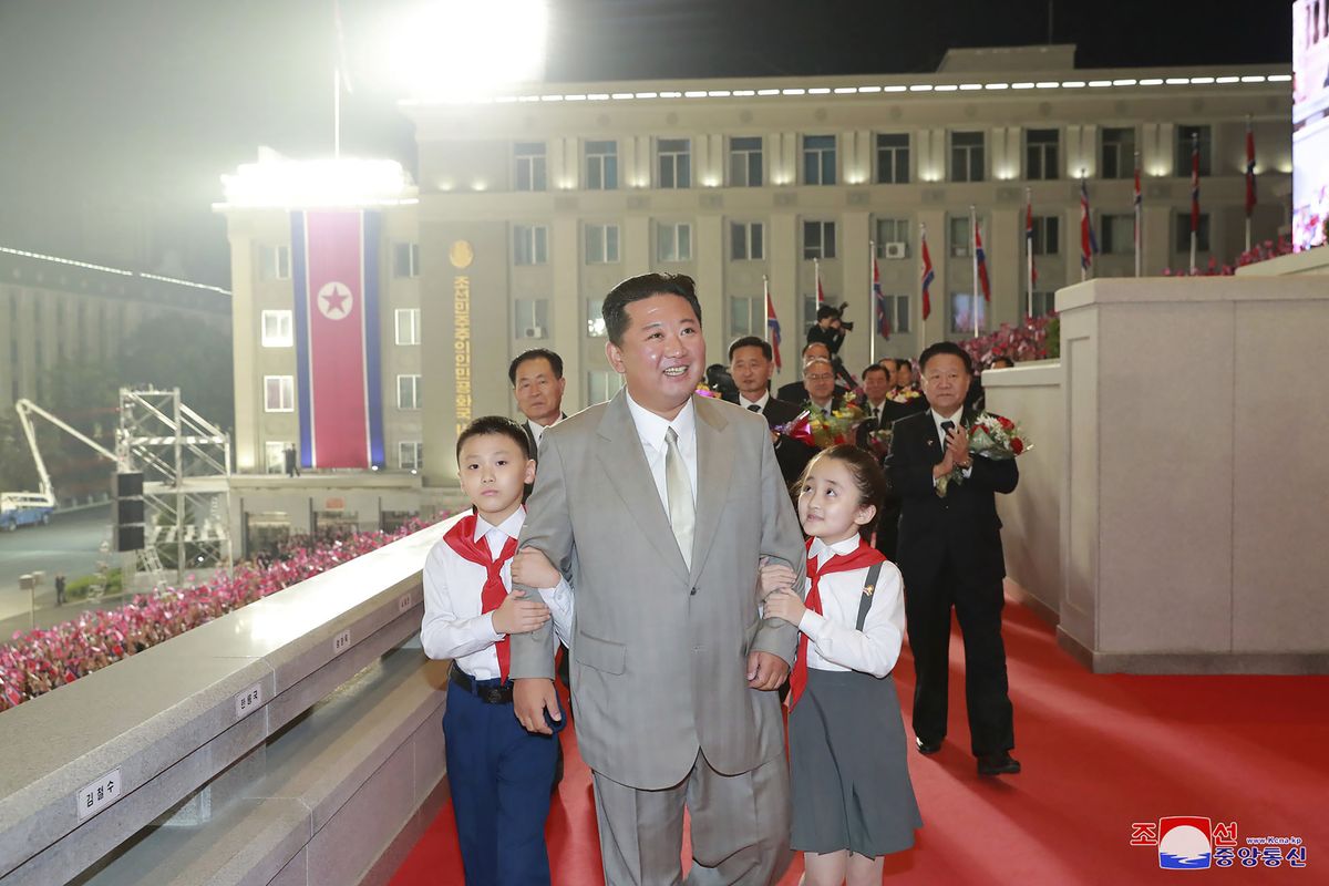In this photo provided by the North Korean government, North Korean leader Kim Jong Un walks with children during a celebration of the nation’s 73rd anniversary at Kim Il Sung Square in Pyongyang, North Korea, early Thursday, Sept. 9, 2021. Independent journalists were not given access to cover the event depicted in this image distributed by the North Korean government. The content of this image is as provided and cannot be independently verified. Korean language watermark on image as provided by source reads: "KCNA" which is the abbreviation for Korean Central News Agency.  (HOGP)