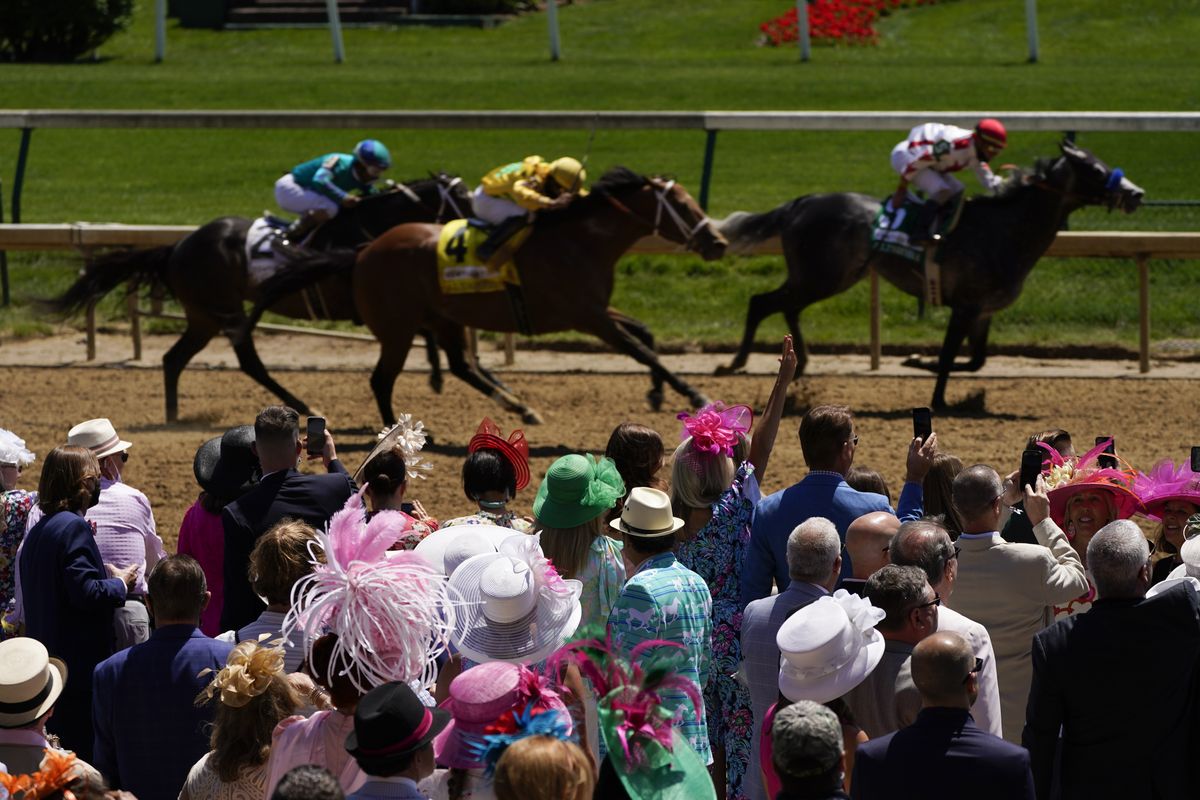 Fans watch race six before 147th running of the Kentucky Oaks at Churchill Downs, Friday, April 30, 2021, in Louisville, Ky.  (Associated Press)