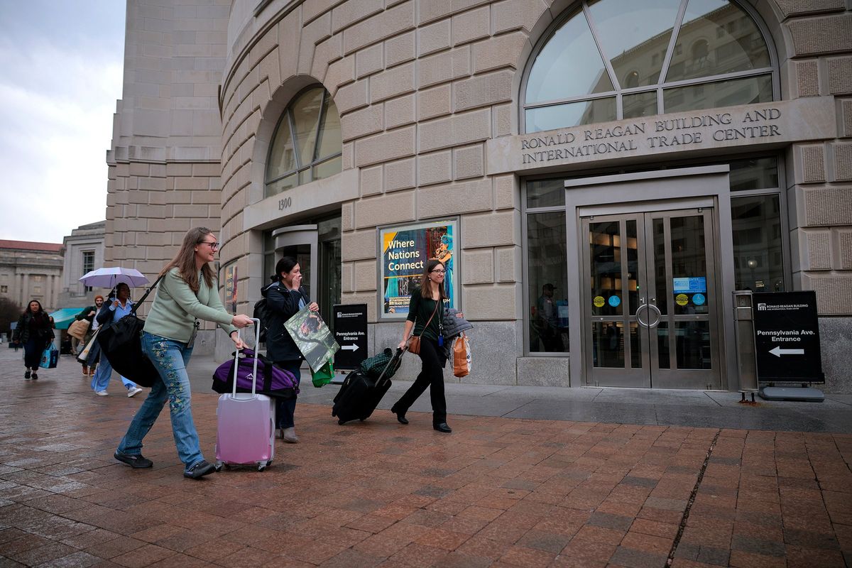 Former U.S. Agency for International Development employees terminated after the Trump administration dismantled the agency collect their personal belongings at the USAID headquarters on Feb. 27 in Washington, D.C. (Chip Somodevilla)
