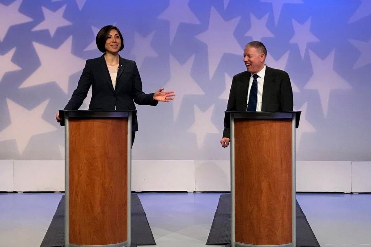 Paulette Jordan, left, and A.J. Balukoff, right, laugh together just before the start of a statewide debate that was broadcast live on Idaho Public Television on April 22, 2018. The two are facing off in the Democratic primary for governor on May 15. (Betsy Z. Russell / The Spokesman-Review)
