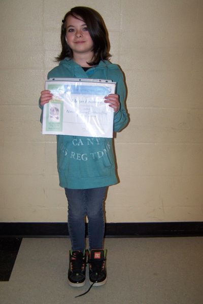 Megan Anderson, of Springdale Elementary School, holds up her winning poster.