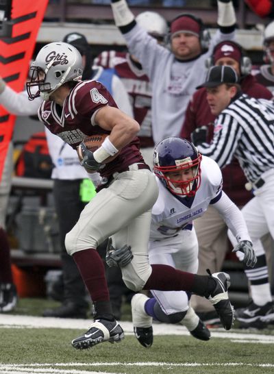 Montana safety Erik Stoll intercepts a pass in playoff victory against Stephen F. Austin.  (Associated Press)