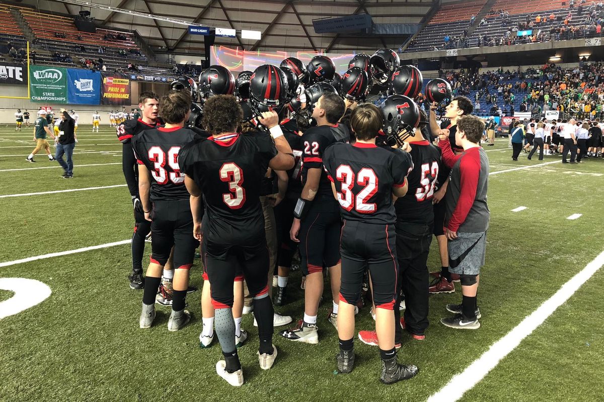 The Liberty Lancers  sing the school’s fight song after falling to Kalama 28-27 in the State 2B title game on Saturday at the Tacoma Dome. (Dave Nichols / The Spokesman-Review)