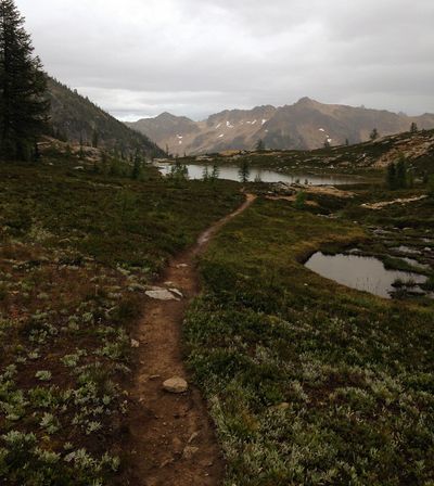 In this August 2016 photo, a trail runs past the lower lake at Snowy Lakes, near the Pacific Crest Trail. (Jessi Loerch / Associated Press)