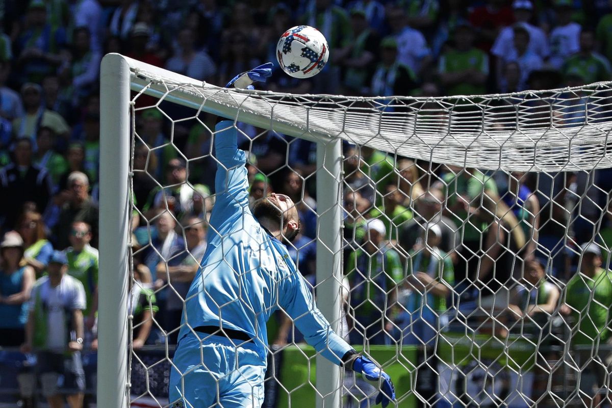 Seattle Sounders goalkeeper Stefan Frei leaps to knock a ball over the cross bar during the first half of an MLS soccer match against the Portland Timbers, Saturday, May 27, 2017, in Seattle. (Ted S. Warren / Associated Press)