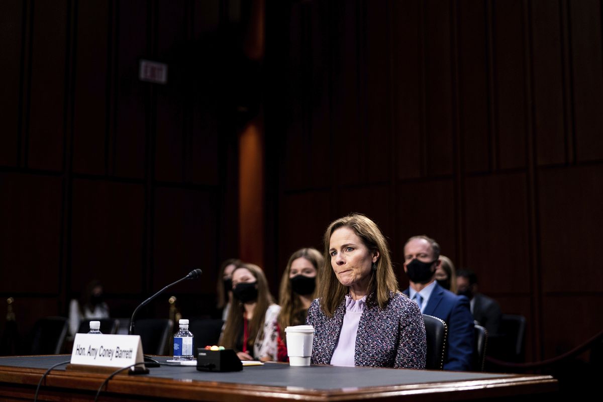 FILE - In this Oct. 14, 2020, file photo, Supreme Court nominee Amy Coney Barrett listens during a confirmation hearing before the Senate Judiciary Committee on Capitol Hill in Washington. Barrett served for nearly three years on the board of a private Christian school that effectively barred admission to children of same-sex parents and made it plain openly gay and lesbian teachers weren’t welcome in the classroom.  (Erin Schaff)