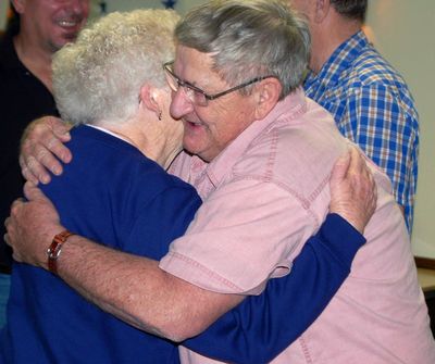 Dennis Enger of Portland, N.D., receives a hug Friday, May 14, 2010,  after he was honored for making hundreds of walking sticks for wounded veterans at Walter Reed Army Medical Center in Washington. (Dave Kolpack / Associated Press)
