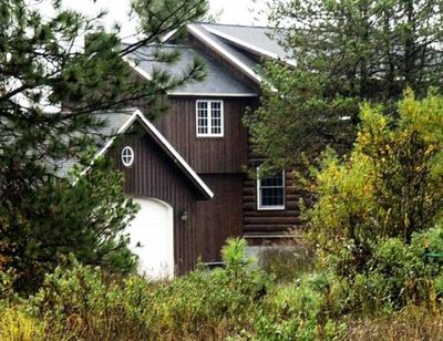 Idaho state Rep. Phil Hart's log home in Athol, Idaho, built partly with logs taken from state school endowment land (Kathy Plonka / SR file photo)