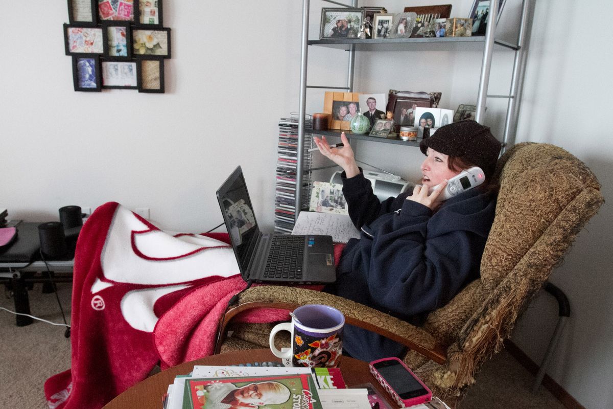From a recliner in her living room, Deanna Kirkpatrick works on a podcast about multiple sclerosis. Kirkpatrick has an aggressive form of the disease and spends up to 80 percent of her time in bed or in a recliner. (MIKE BONNICKSEN)