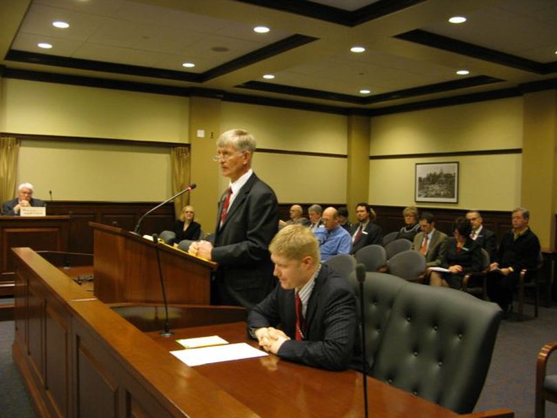 Rep. Steven Thayn, R-Emmett, speaks to the House Education Committee promoting HB 493, a proposal for a pilot program on incentives for students who move through school more quickly, including scholarships for those who graduate at least a year early. His co-sponsor, Rep. Branden Durst, D-Boise, is seated next to him. The bipartisan pair said their plan is designed to improve education while saving the state money. (Betsy Russell)