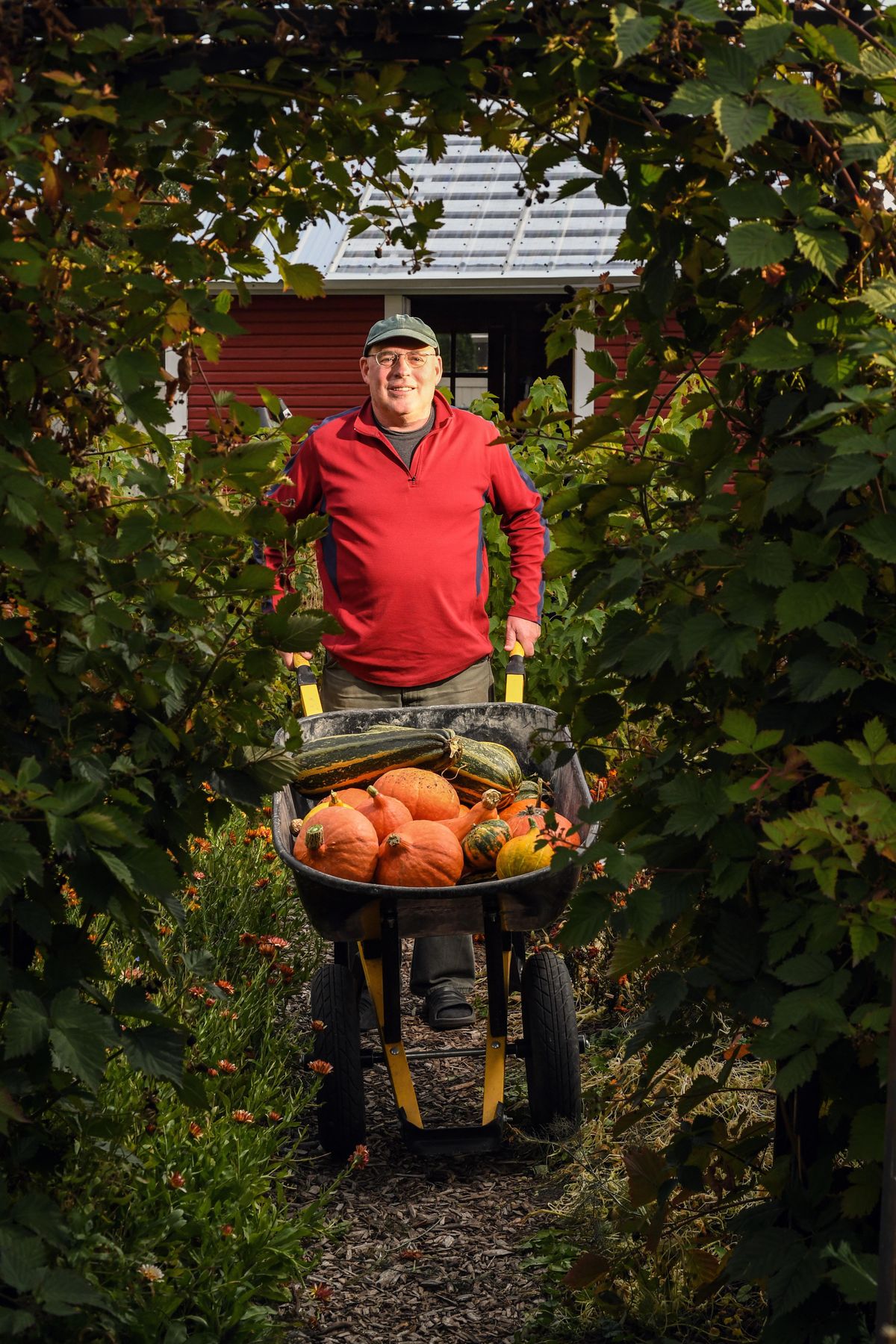 Matt and Della Holbert grow much of their food and make their own wine at their suburban food paradise on West Glass Avenue in north Spokane. (Colin Mulvany / The Spokesman-Review)