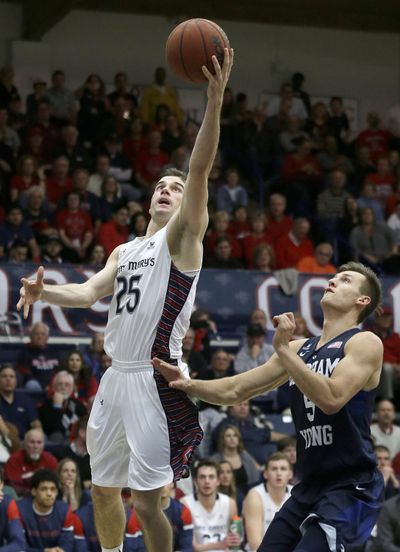 Saint Mary’s guard Joe Rahon, left, knew the Gaels had the players to compete for a WCC championship. (Jeff Chiu / Associated Press)