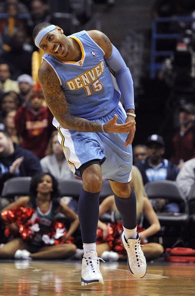 Denver Nuggets' Carmelo Anthony (15) reacts after making a basket against the Milwaukee Bucks during the second half of an NBA basketball game Wednesday, Feb. 16, 2011, in Milwaukee. The Nuggets defeated the Bucks 94-87. (Associated Press / Fr59933 Ap)