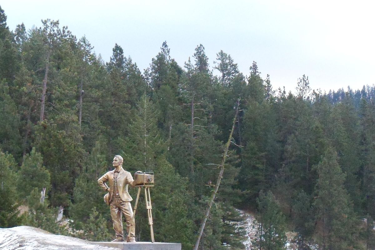 This sculpture of a 19th century photographer by Coeur d’Alene artist David Clemons has graced the shoreline of Lake Coeur d’Alene for years. (Courtesy of Randall Butt / Idaho Department of Parks and Recreation)