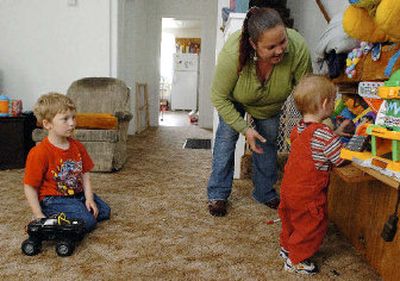 
Amy Lopez with sons Johnny, left, and Troy in their Eureka, Calif., home. For the Lopez family, the $70 cost of filling up their Ford minivan has made it tough to get by every month. 
 (Associated Press / The Spokesman-Review)