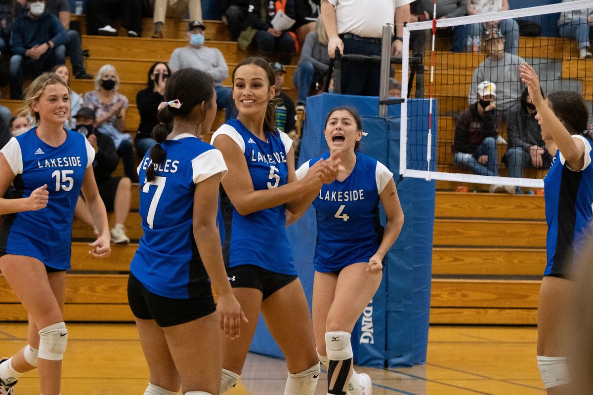 Lakeside players celebrate winning the first set against visitor Riverside during a Northeast A League game Tuesday in Nine Mile Falls.  (Madison McCord/For The Spokesman-Review)