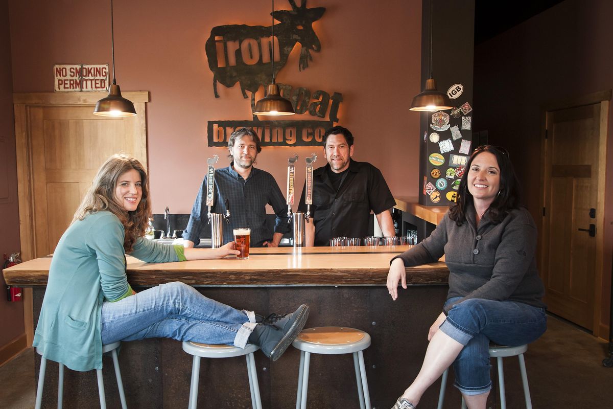 Left to right, Sheila Evans, Paul Edminster, Greg and Heather Brandt pose in this file photo in 2012, when they opened their first tasting room on East Mallon Avenue. (Colin Mulvany / The Spokesman-Review)