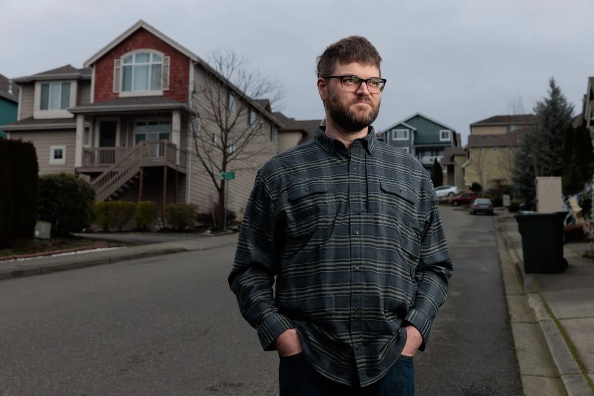 Justin Lyon, a construction project manager, has been looking for work in what’s become a very difficult job market for construction workers. Lyon is pictured outside his home in Renton.  (Erika Schultz/Seattle Times )