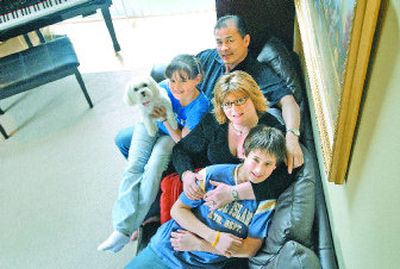
From top, Winston Tan and his family: Madison, 10; Julie; Michael, 12; and the family dog, Mollie. The family moved to Spokane from Atlanta. 
 (Brian Plonka / The Spokesman-Review)